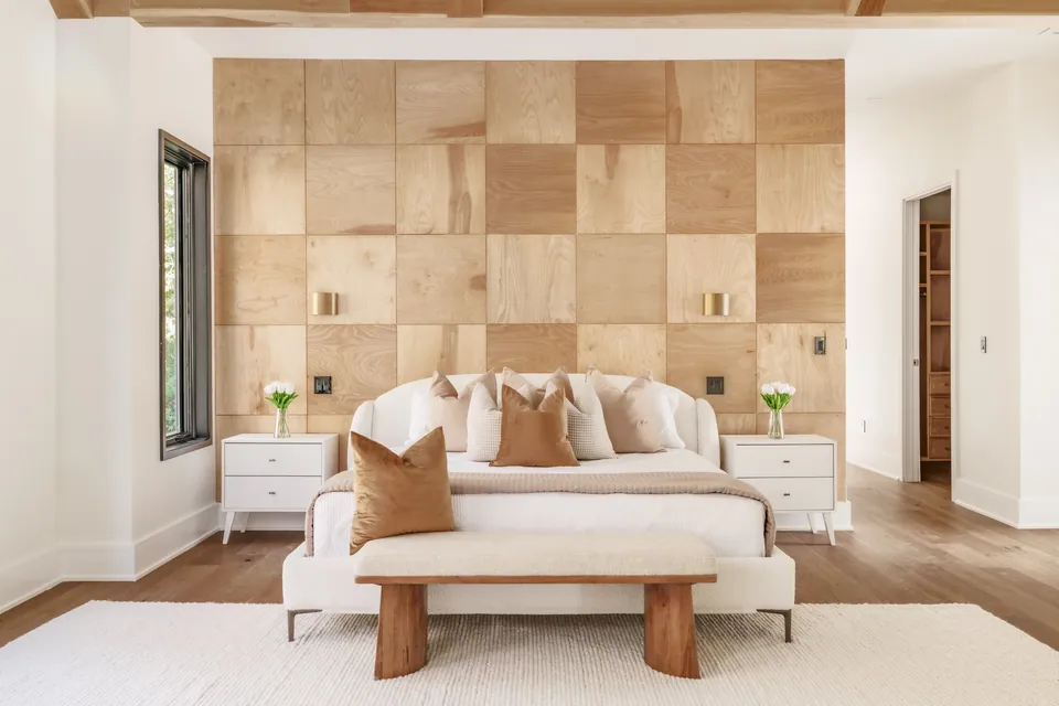 Bedroom with wood-paneled accent wall